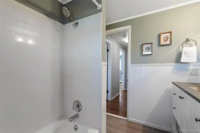 a bathroom with a bathtub and a shower