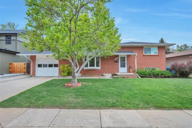 a house view with a garden space