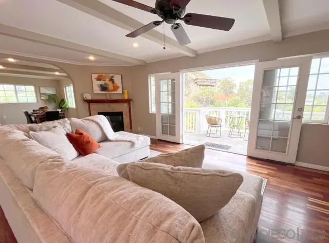 a bedroom with two beds and a large window