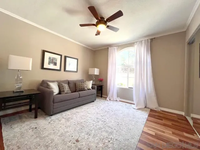 a living room with furniture and a window