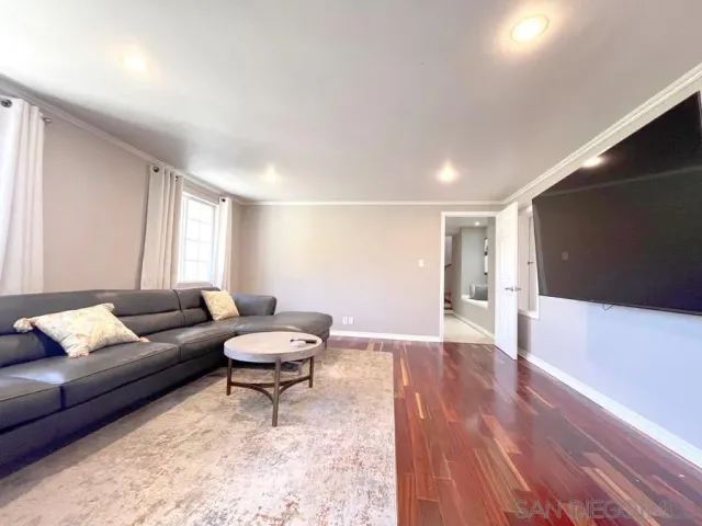 a living room with a couch and a flat screen tv