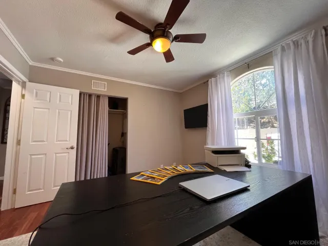 a bedroom with bed and window
