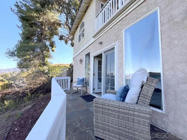 a view of a balcony with furniture