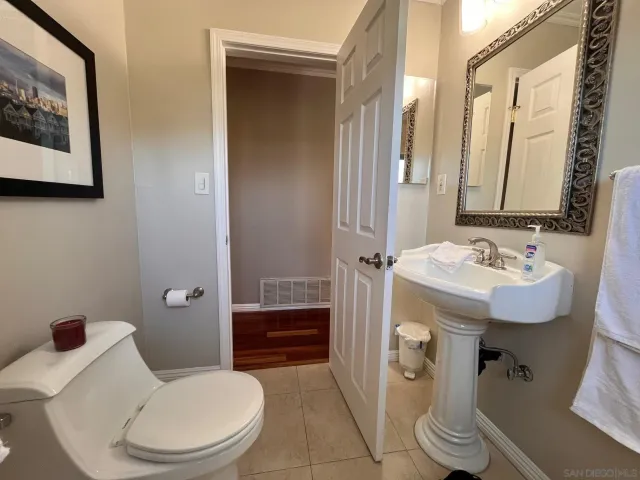 an aerial view of residential house with outdoor space and trees all around