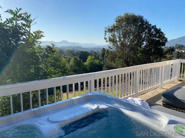 a view of a deck with a yard