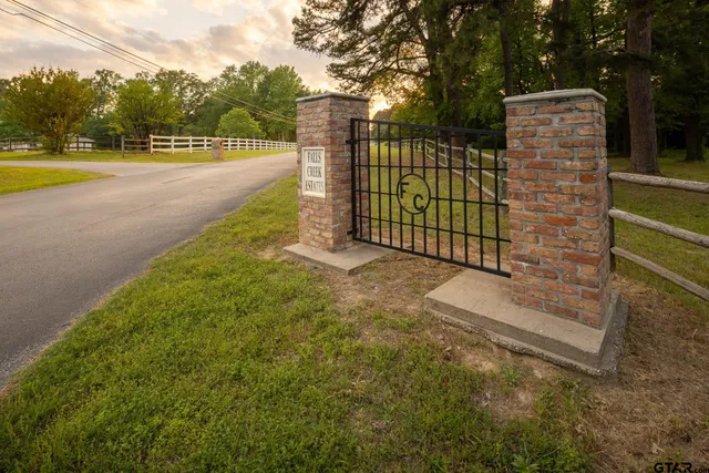 a view of a street with trees in the background
