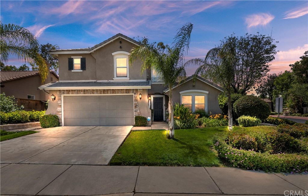 3554 Birchleaf Drive Corona, CA 92881 - Photo 1 of 1 a front view of a house with a yard and garage