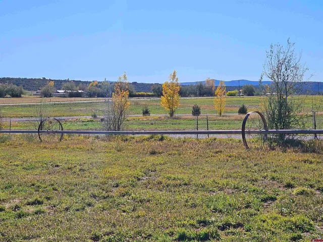 a view of a lake with houses in the background