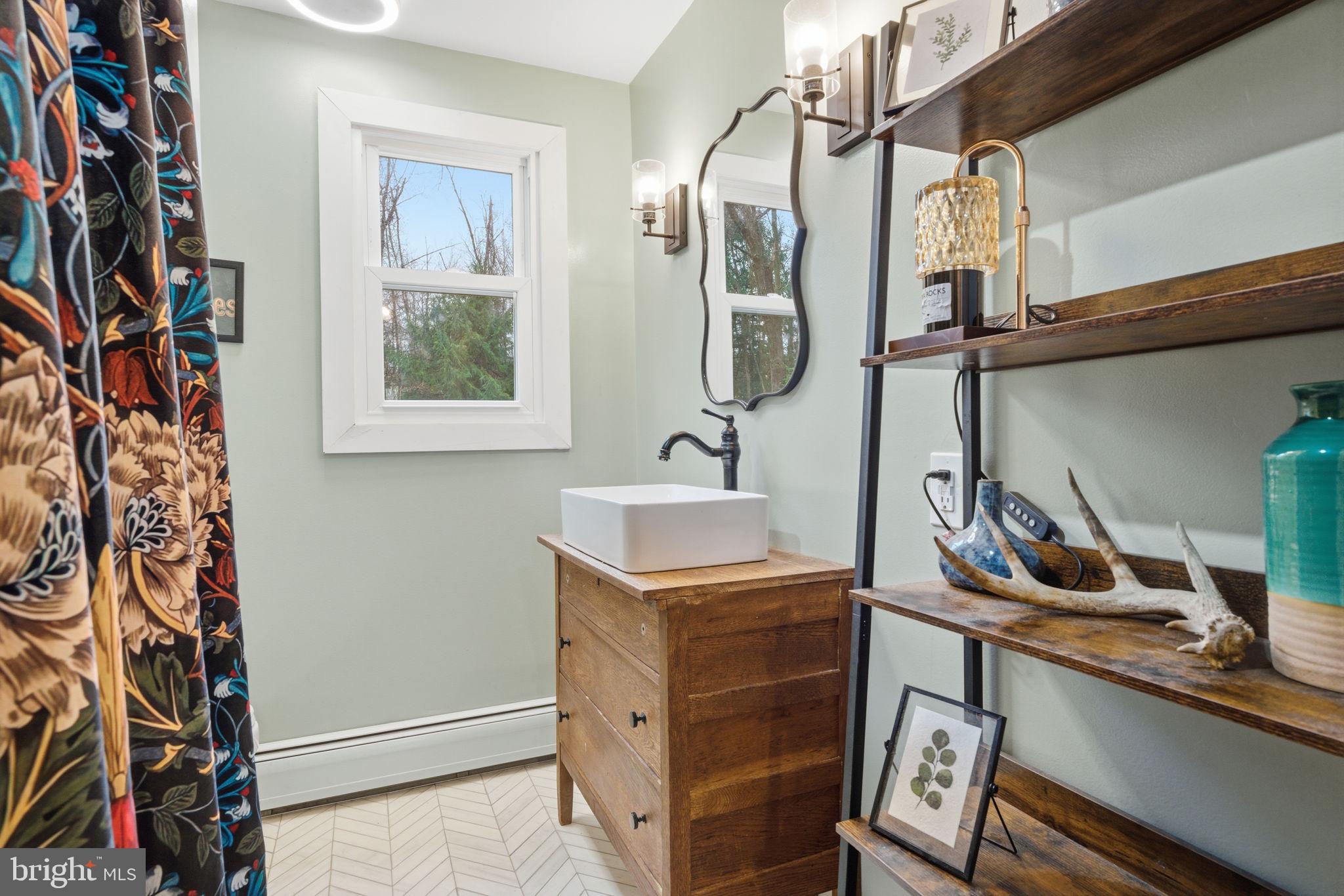 131 Crusher Road Hopewell, NJ 08525 - Photo 15 of 41 a bathroom with a sink and a mirror