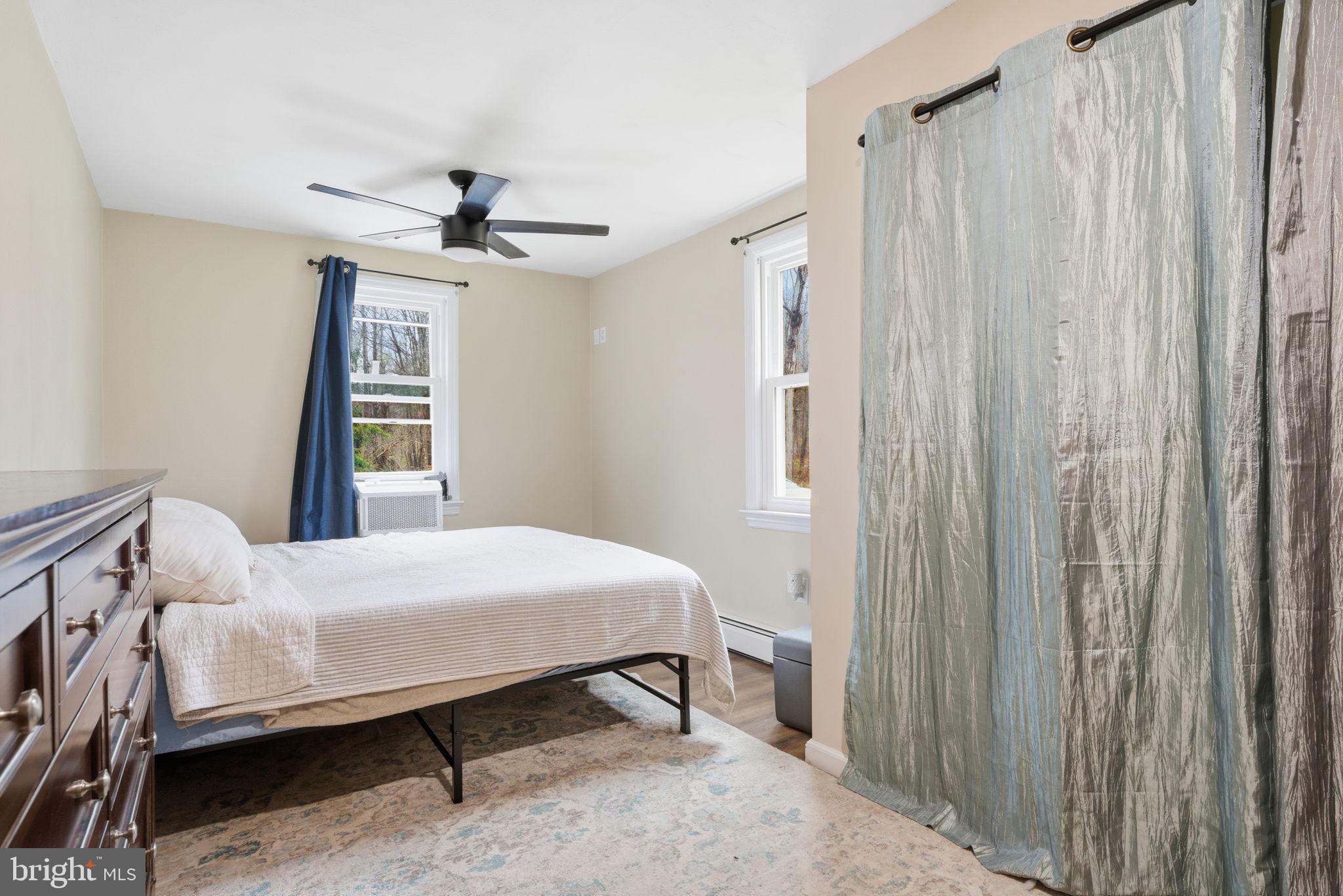 131 Crusher Road Hopewell, NJ 08525 - Photo 19 of 41 a bedroom with a bed and a window