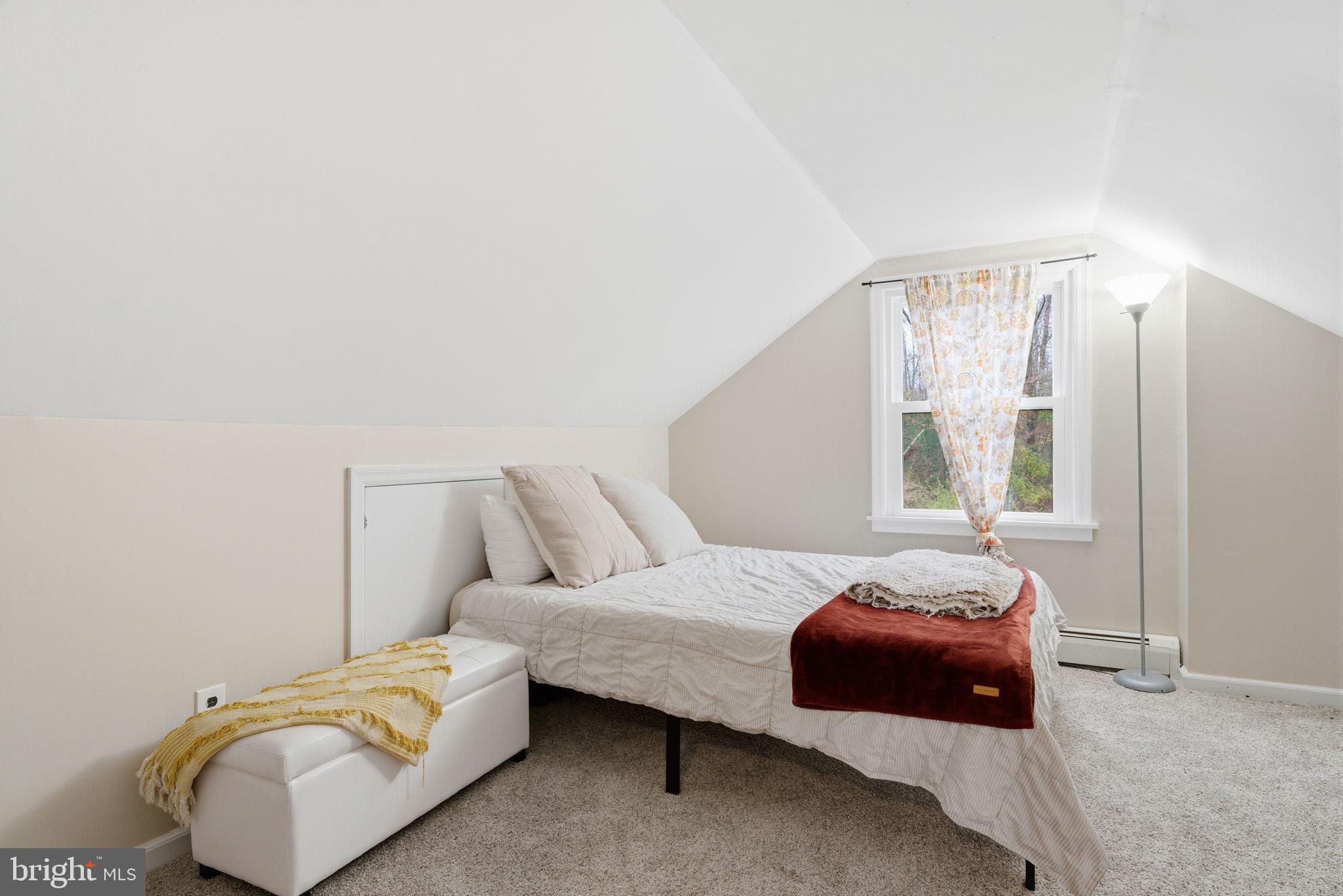 131 Crusher Road Hopewell, NJ 08525 - Photo 23 of 41 a bedroom with a bed and a couch