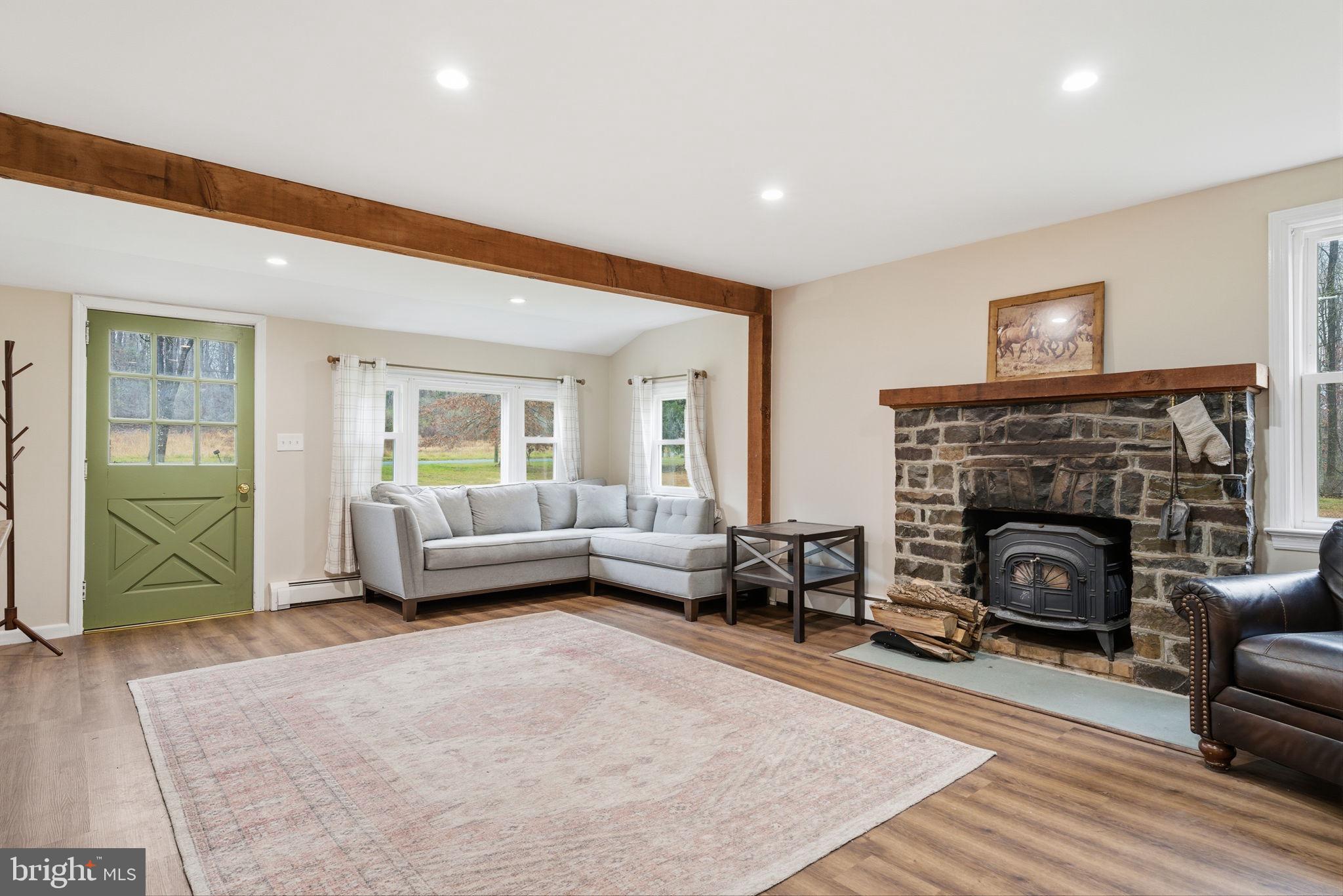 131 Crusher Road Hopewell, NJ 08525 - Photo 7 of 41 a living room with furniture and a fireplace