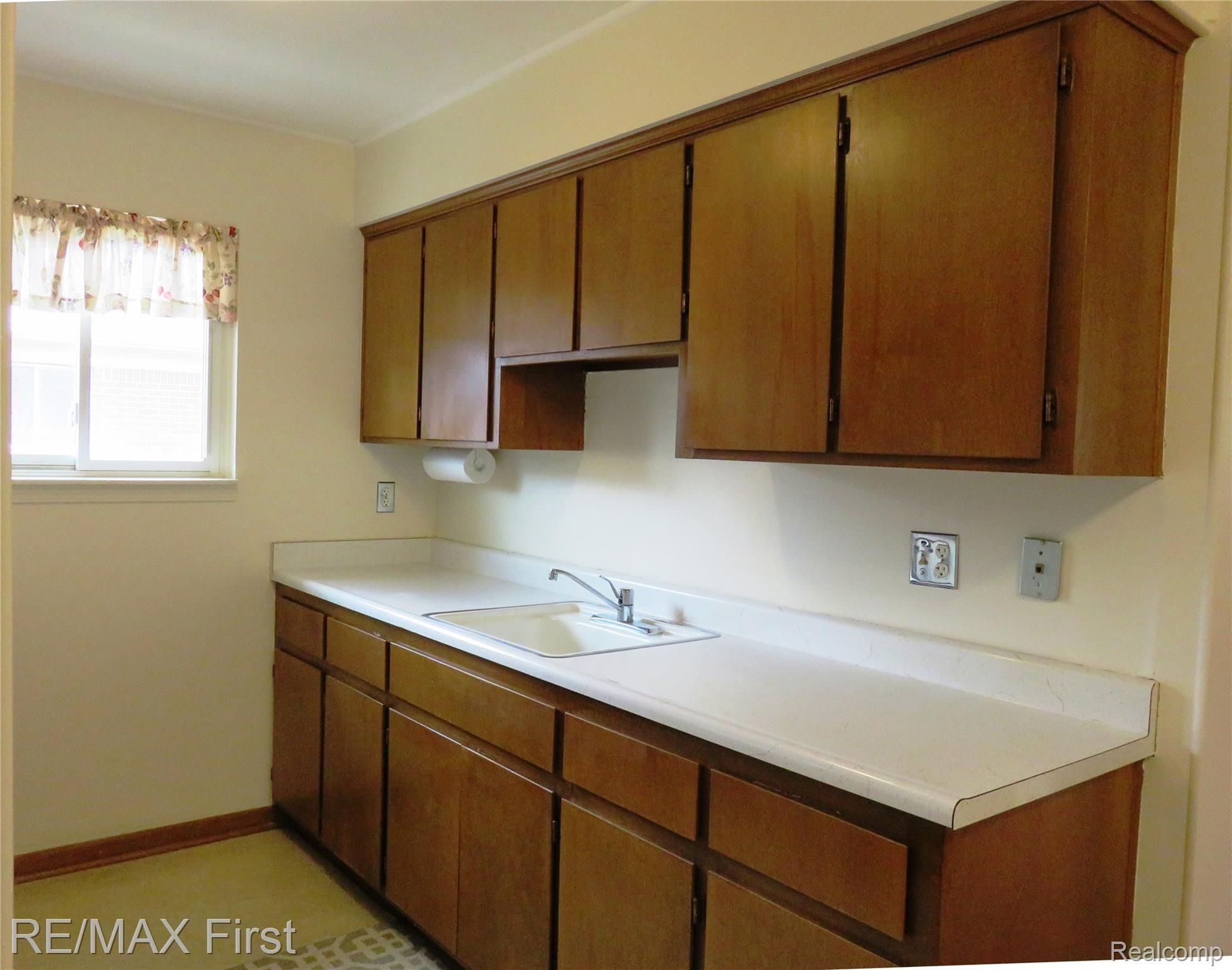15219 East 9 Mile Road, Unit 7 Eastpointe, MI 48021 - Photo 8 of 13 15219 9 mile kitchen.JPG