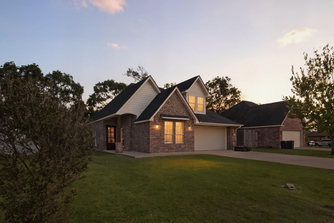 790 Bridgeview Street Bridge City, TX 77611 - Photo 1 of 31 a front view of a house with a garden