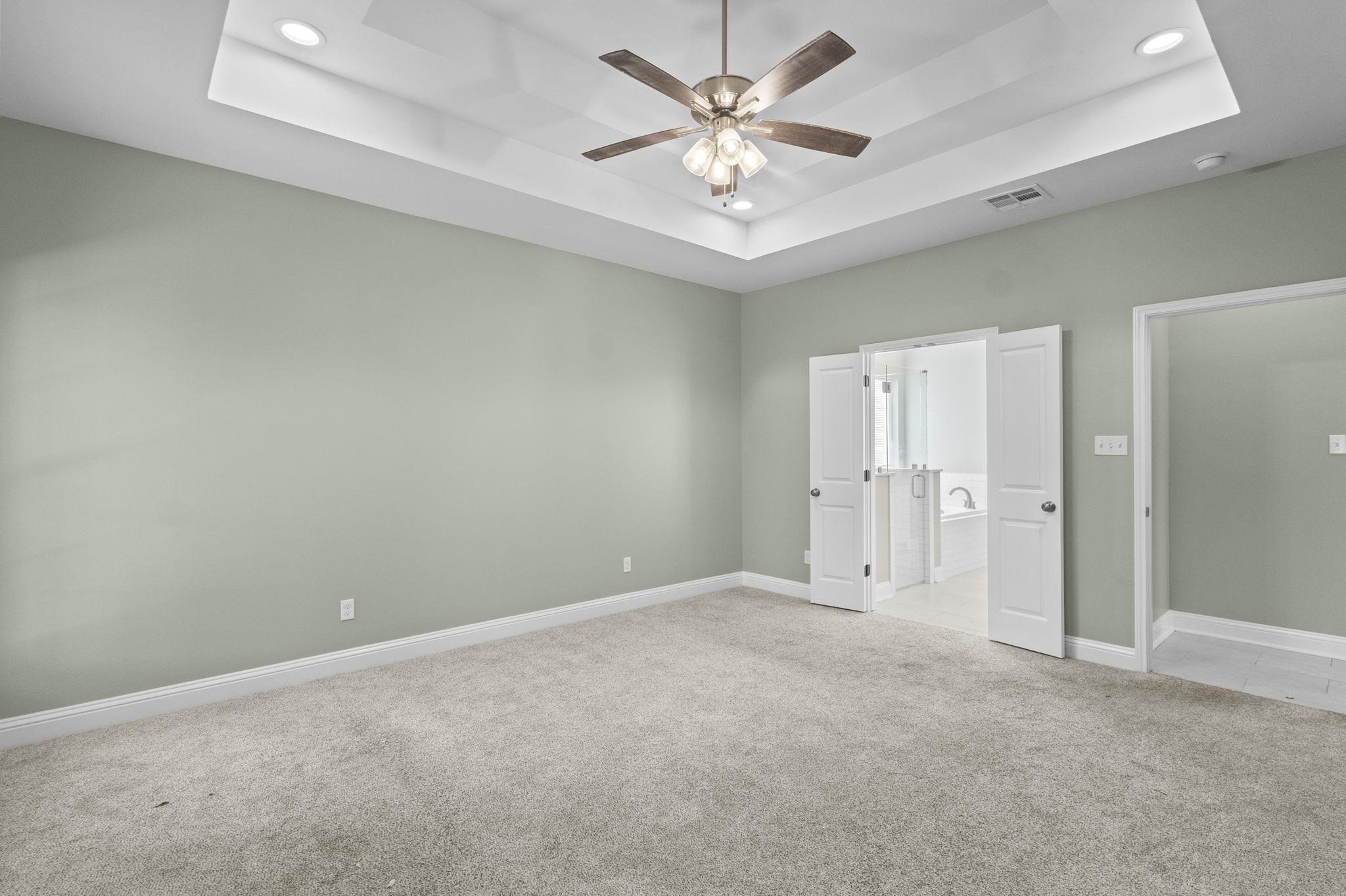 790 Bridgeview Street Bridge City, TX 77611 - Photo 15 of 31 an empty room with a ceiling fan and a window