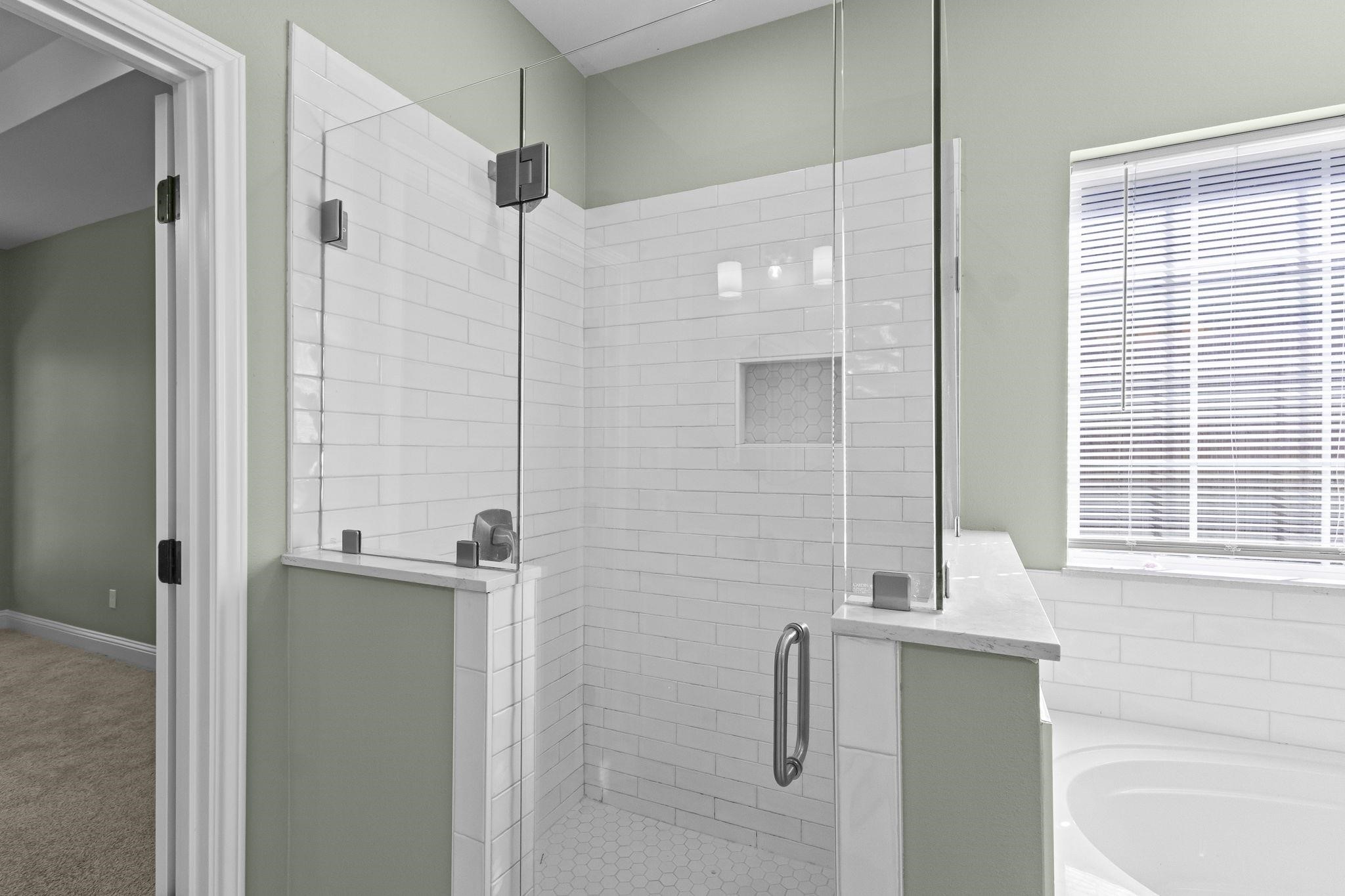 790 Bridgeview Street Bridge City, TX 77611 - Photo 19 of 31 a bathroom with a bathtub and shower