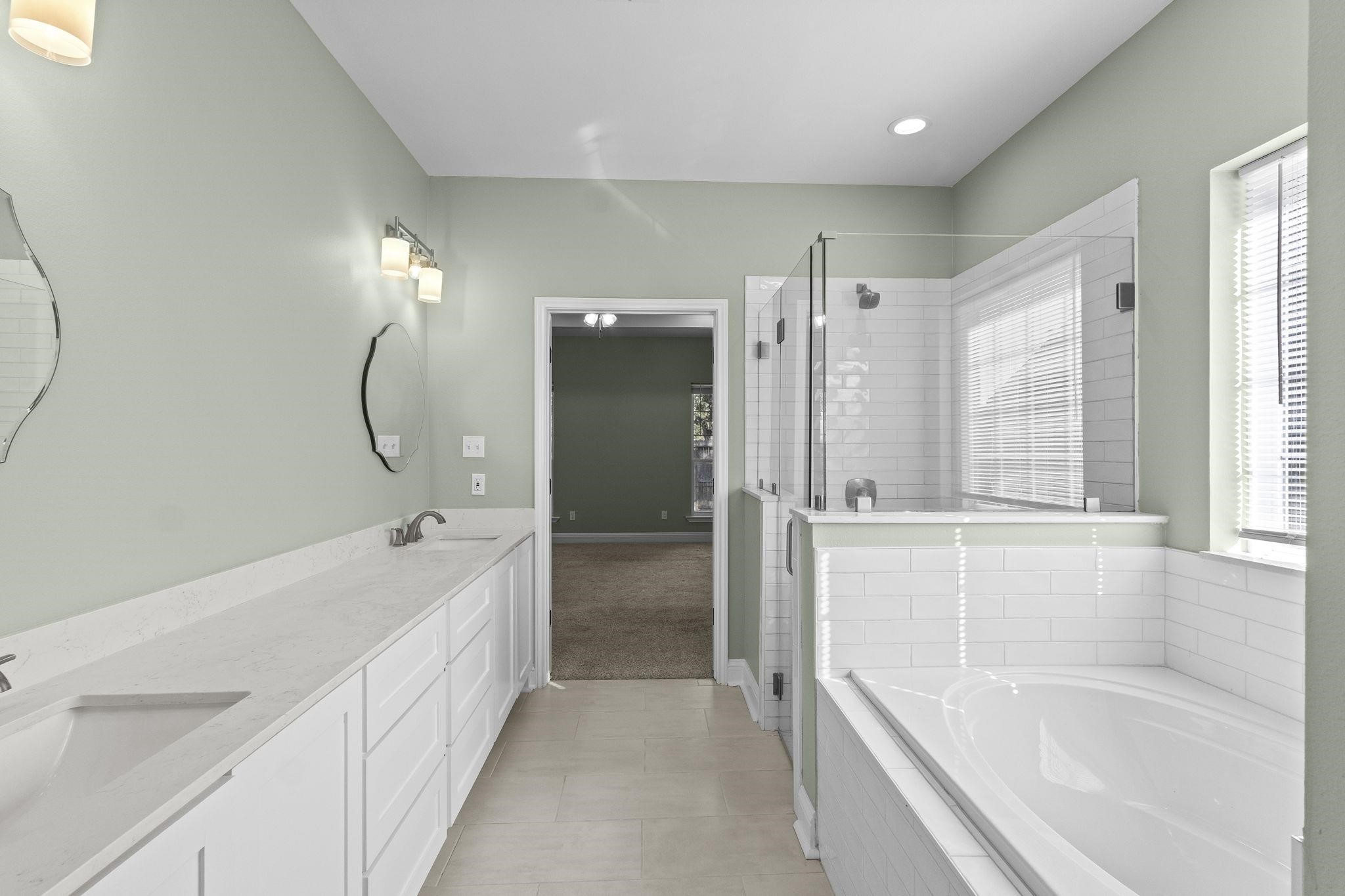 790 Bridgeview Street Bridge City, TX 77611 - Photo 21 of 31 a spacious bathroom with a tub shower and sink