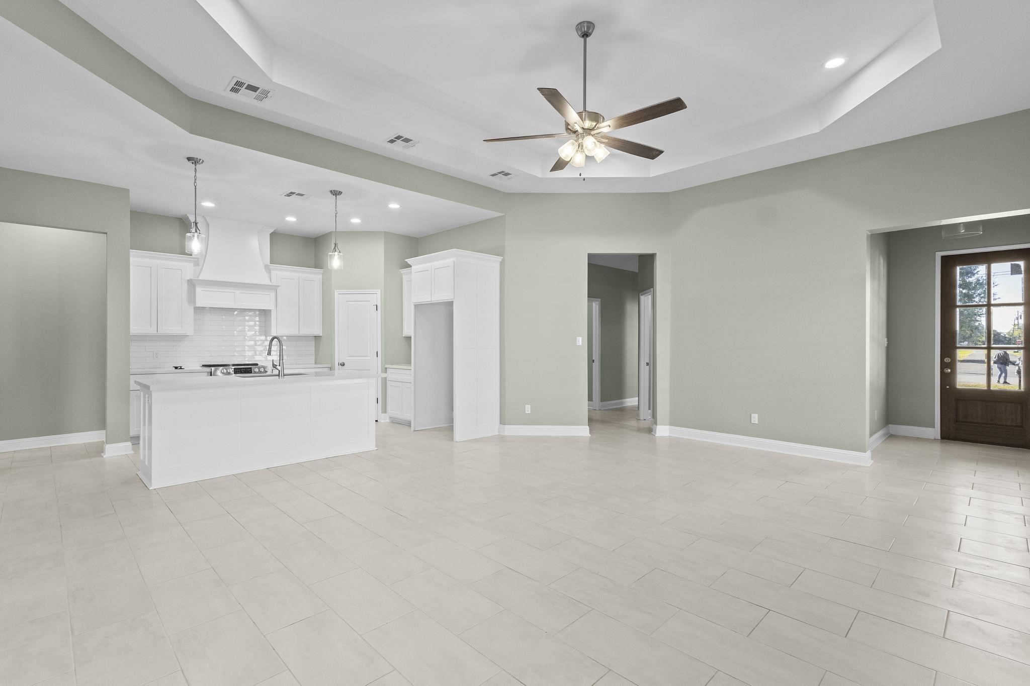 790 Bridgeview Street Bridge City, TX 77611 - Photo 5 of 31 a view of an empty room and kitchen with kitchen appliances