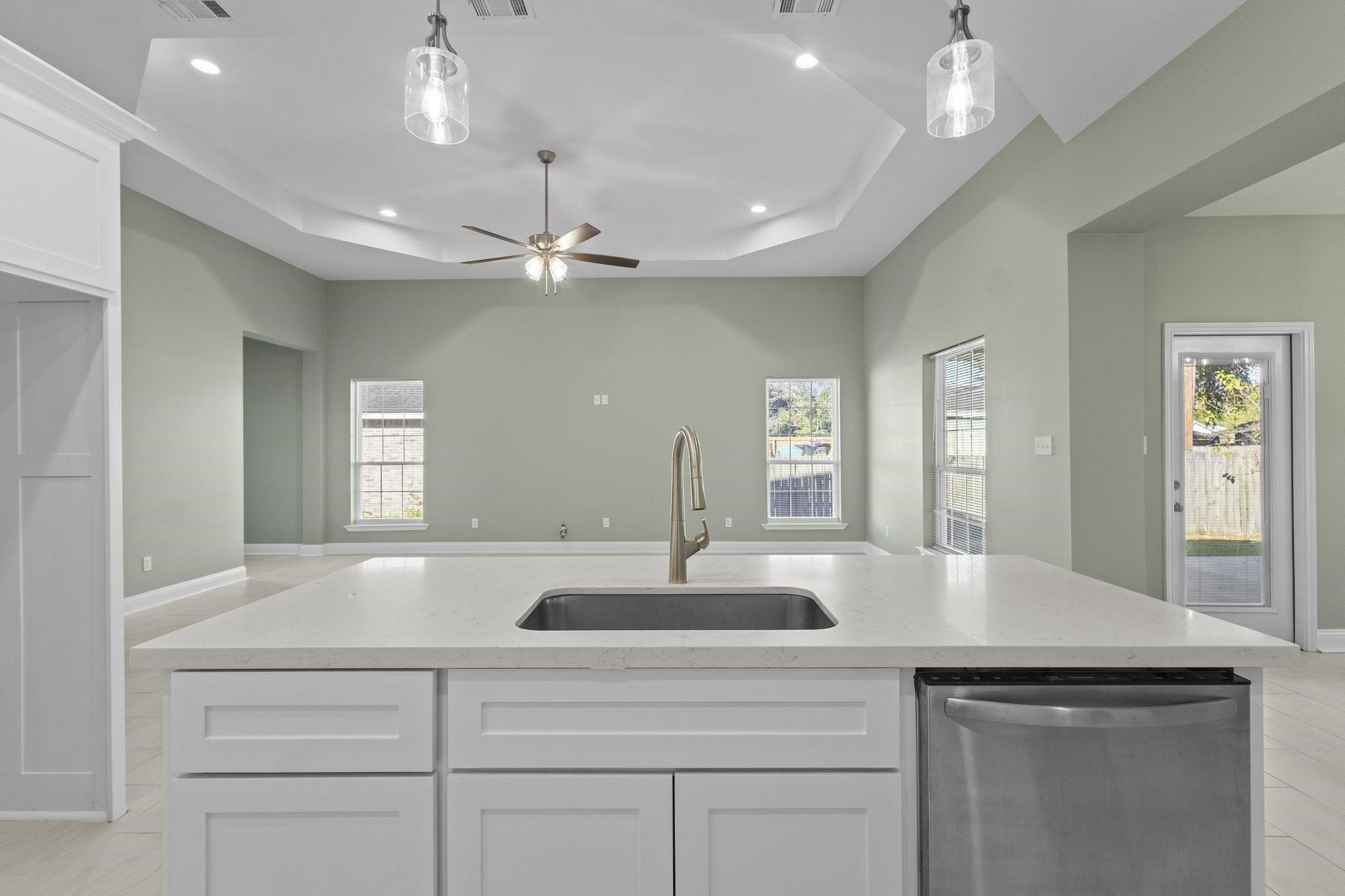 790 Bridgeview Street Bridge City, TX 77611 - Photo 9 of 31 a view with double vanity sink a faucet a lamp and a chandelier