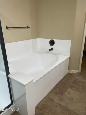 a bathroom with a white tub