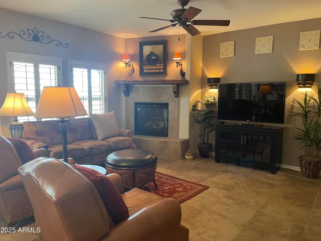 a living room with furniture and a fireplace
