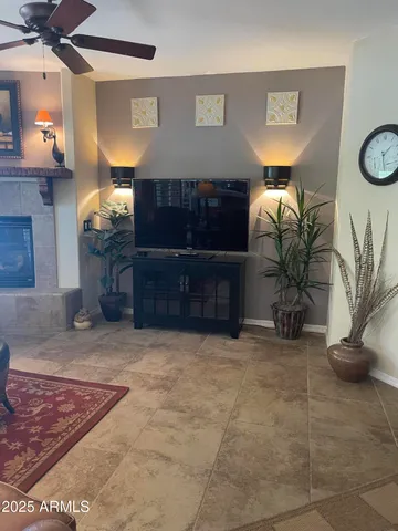 a view of a livingroom with furniture and a potted plant