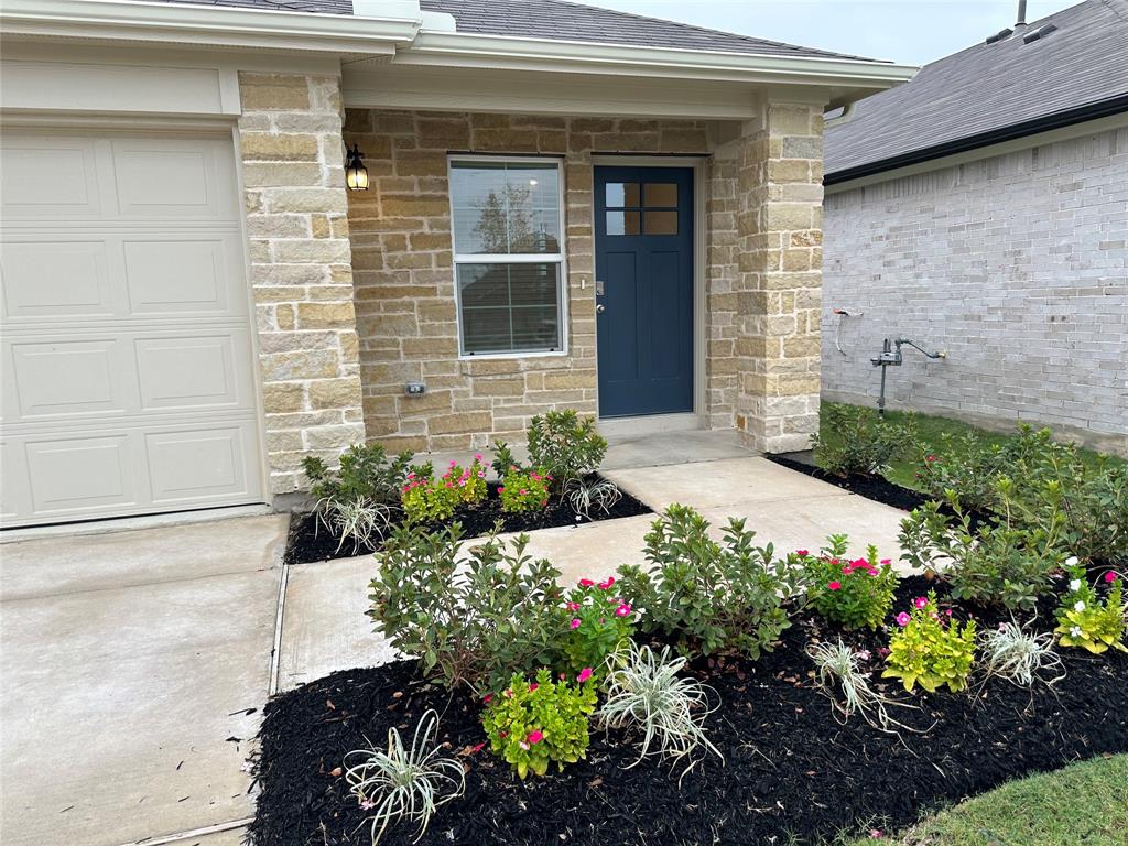 563 Evergreen Sumac Loop Kyle, TX 78640 - Photo 2 of 18 A neatly manicured landscape with varied plantings frames the inviting entryway of this charming residence.