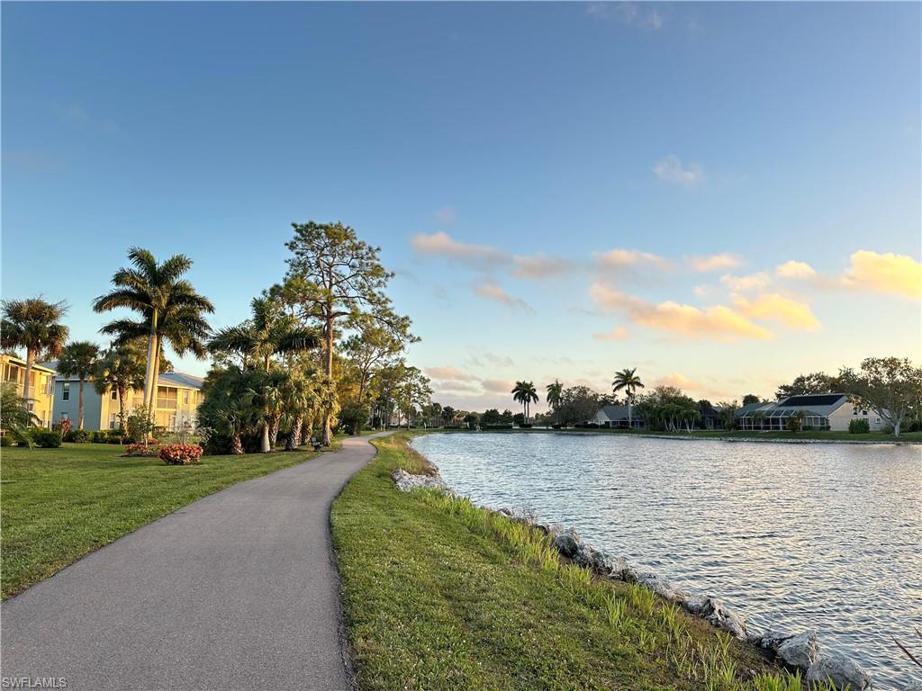 776 Landover Circle, Unit 102 Naples, FL 34104 - Photo 24 of 24 a view of a lake with outdoor space