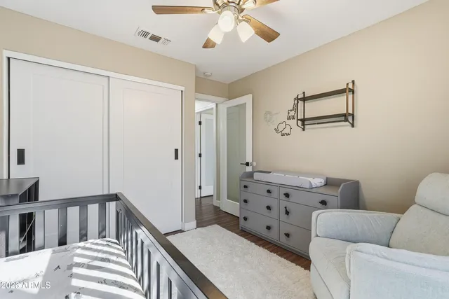 a bedroom with furniture and a window