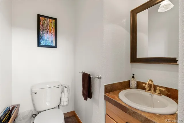 a view of a wooden deck with a yard