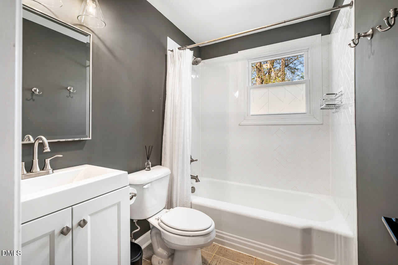 231 Flemington Road Chapel Hill, NC 27517 - Photo 24 of 48 a bathroom with a sink a toilet and shower
