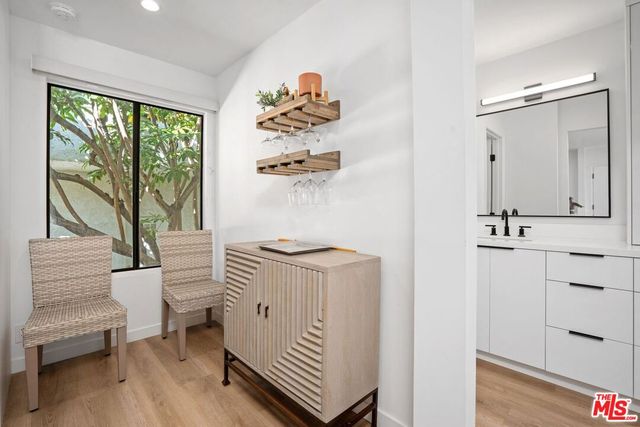 a kitchen with a sink and a stove top oven