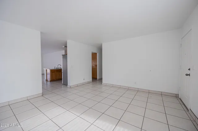 a view of an empty room and window