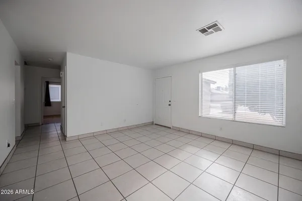 a view of an empty room and window