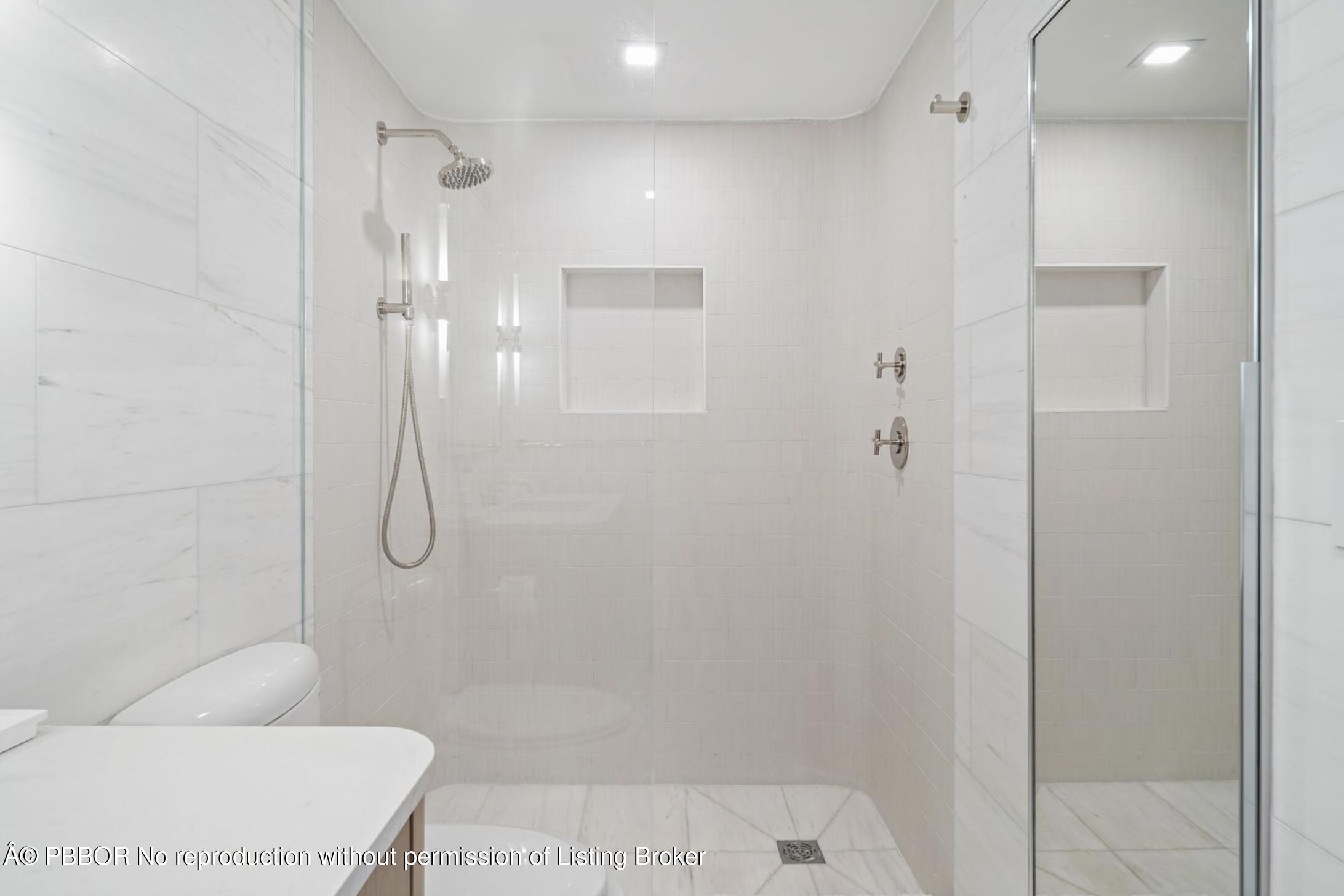333 Sunset Avenue, Unit 611 Palm Beach, FL 33480 - Photo 12 of 24 a bathroom with a shower and a toilet