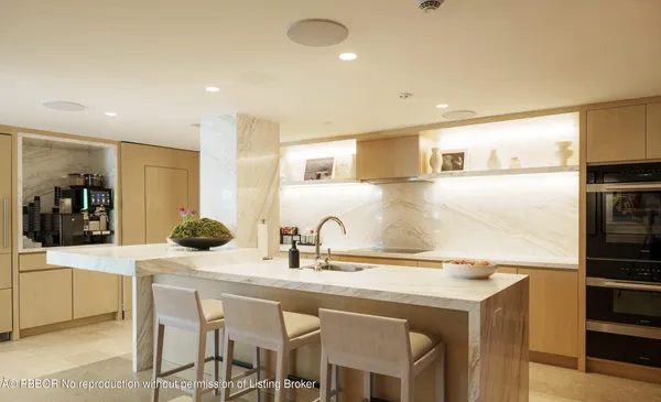 a kitchen with a sink and refrigerator