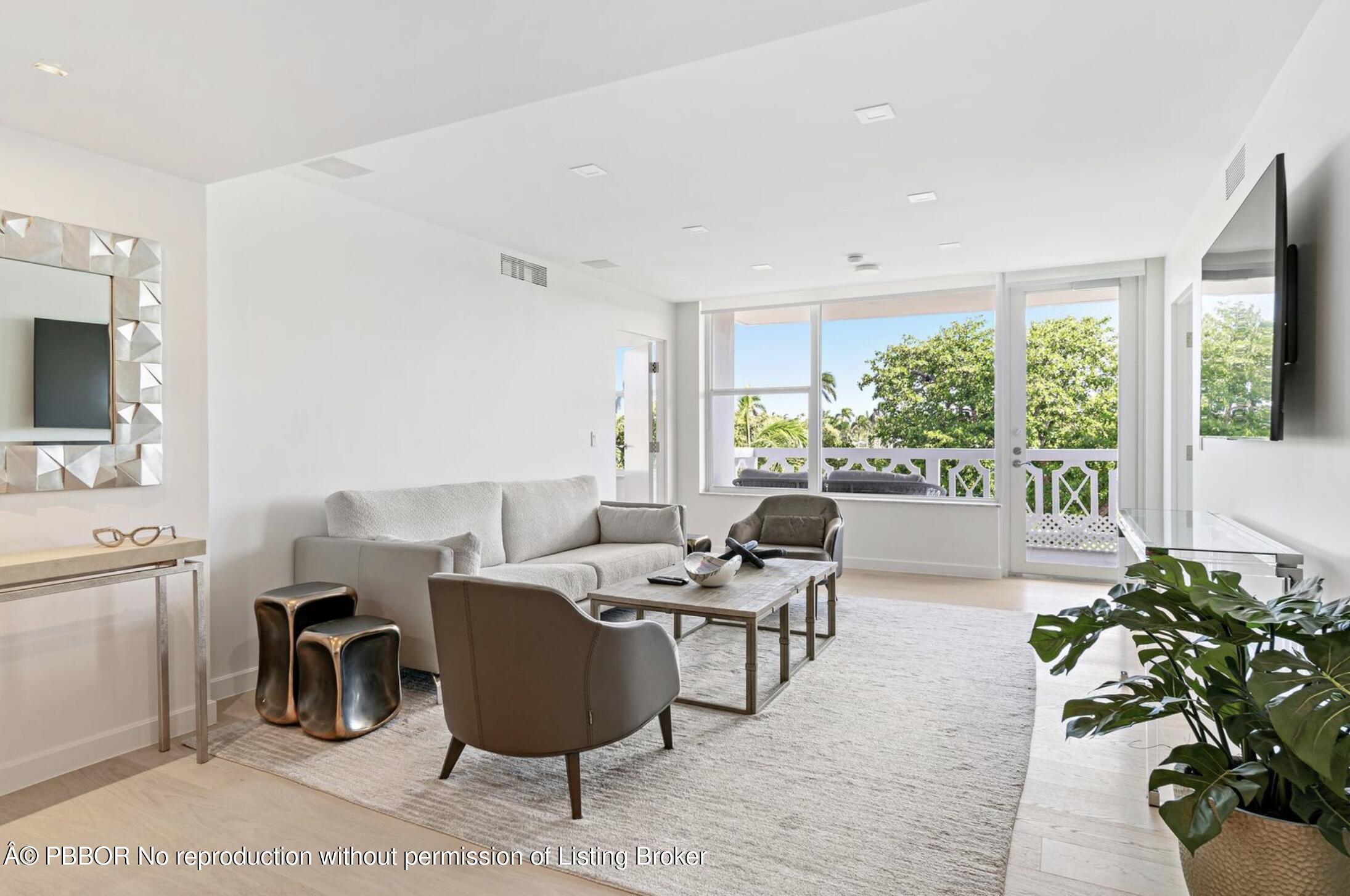 333 Sunset Avenue, Unit 611 Palm Beach, FL 33480 - Photo 4 of 24 a living room with furniture and a large window