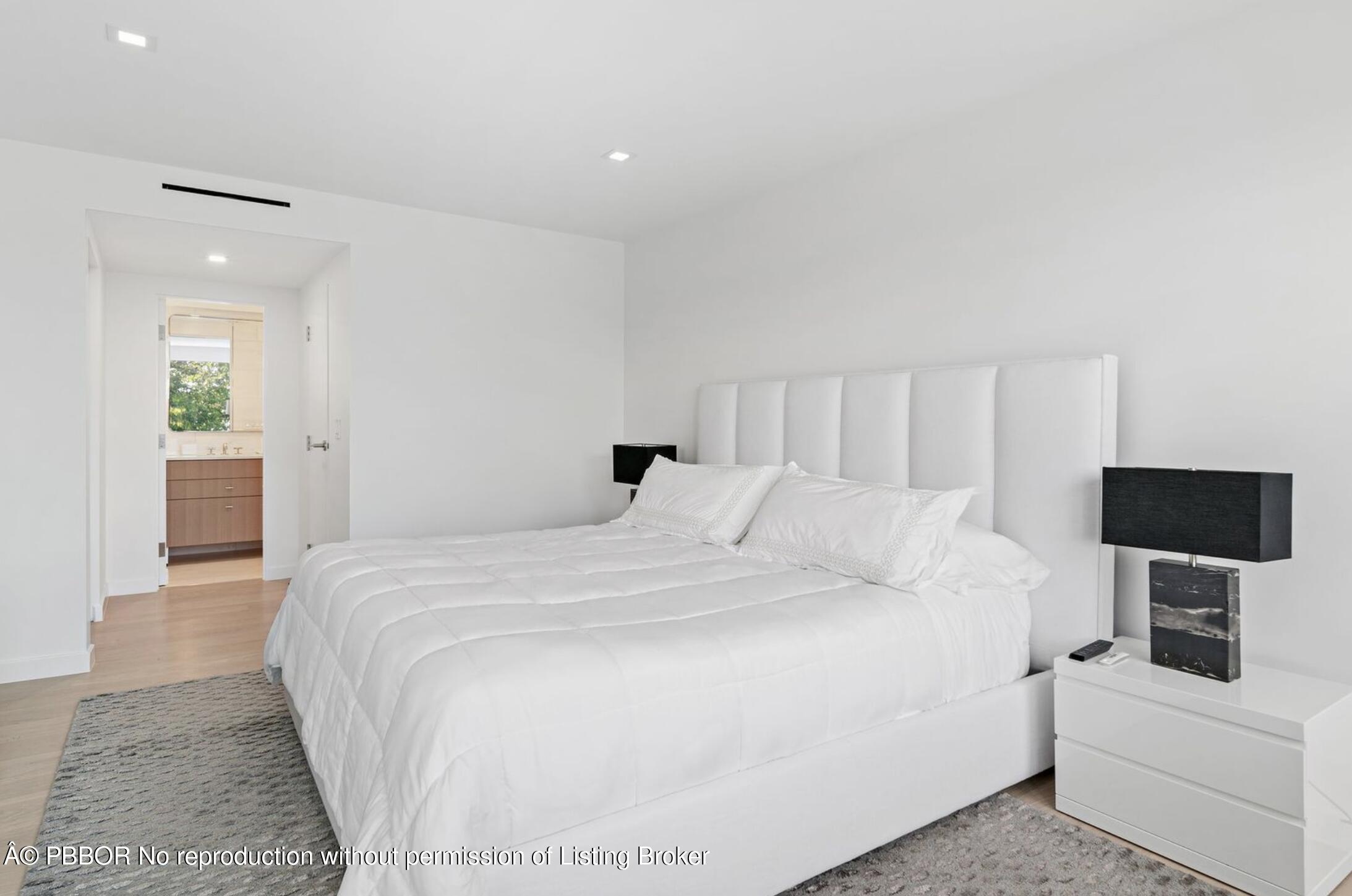 333 Sunset Avenue, Unit 611 Palm Beach, FL 33480 - Photo 10 of 24 a large white bed in a white room