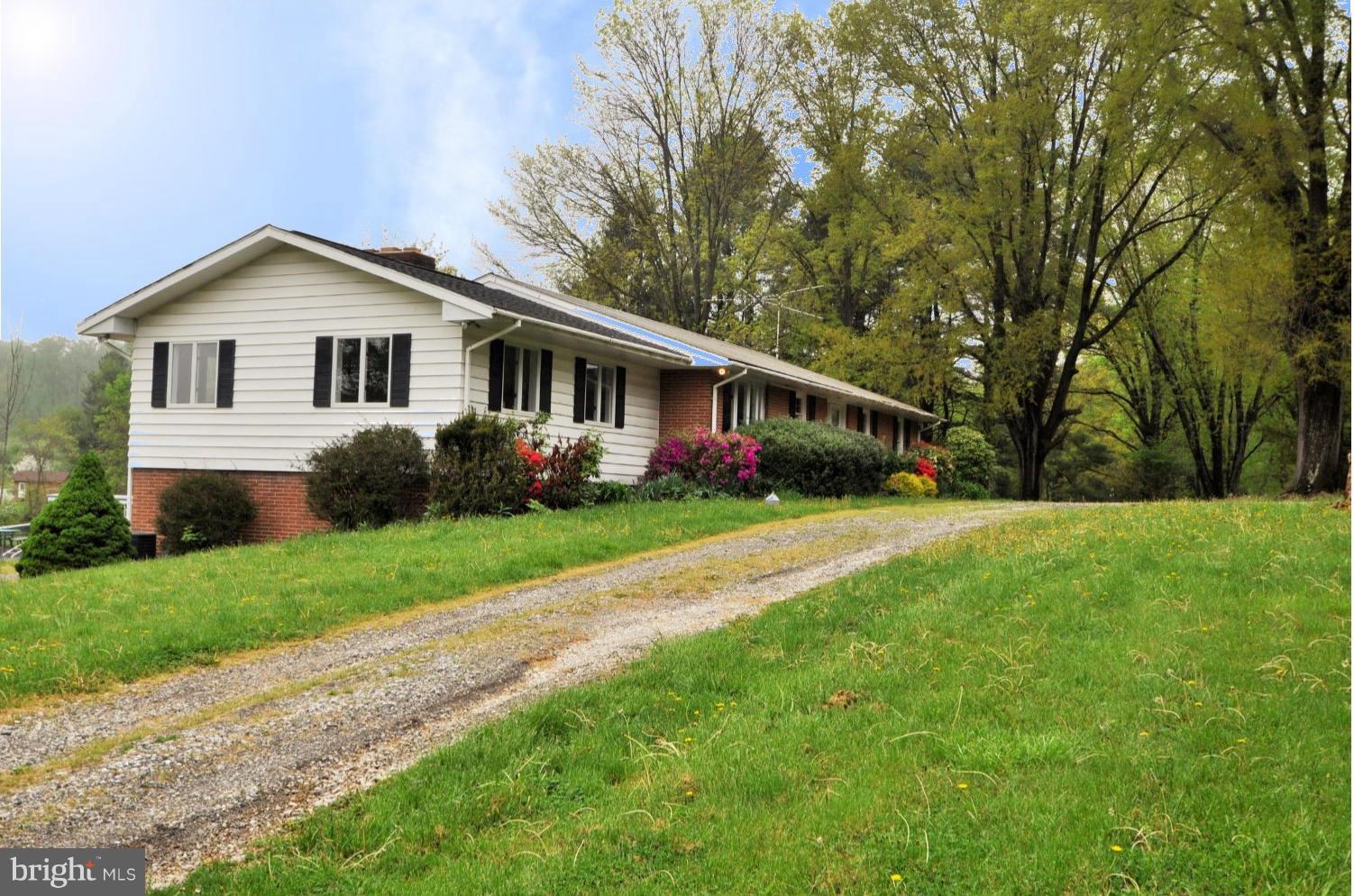 13718 Baldwin Mill Road Baldwin, MD 21013 - Photo 1 of 29 a front view of house with yard and green space