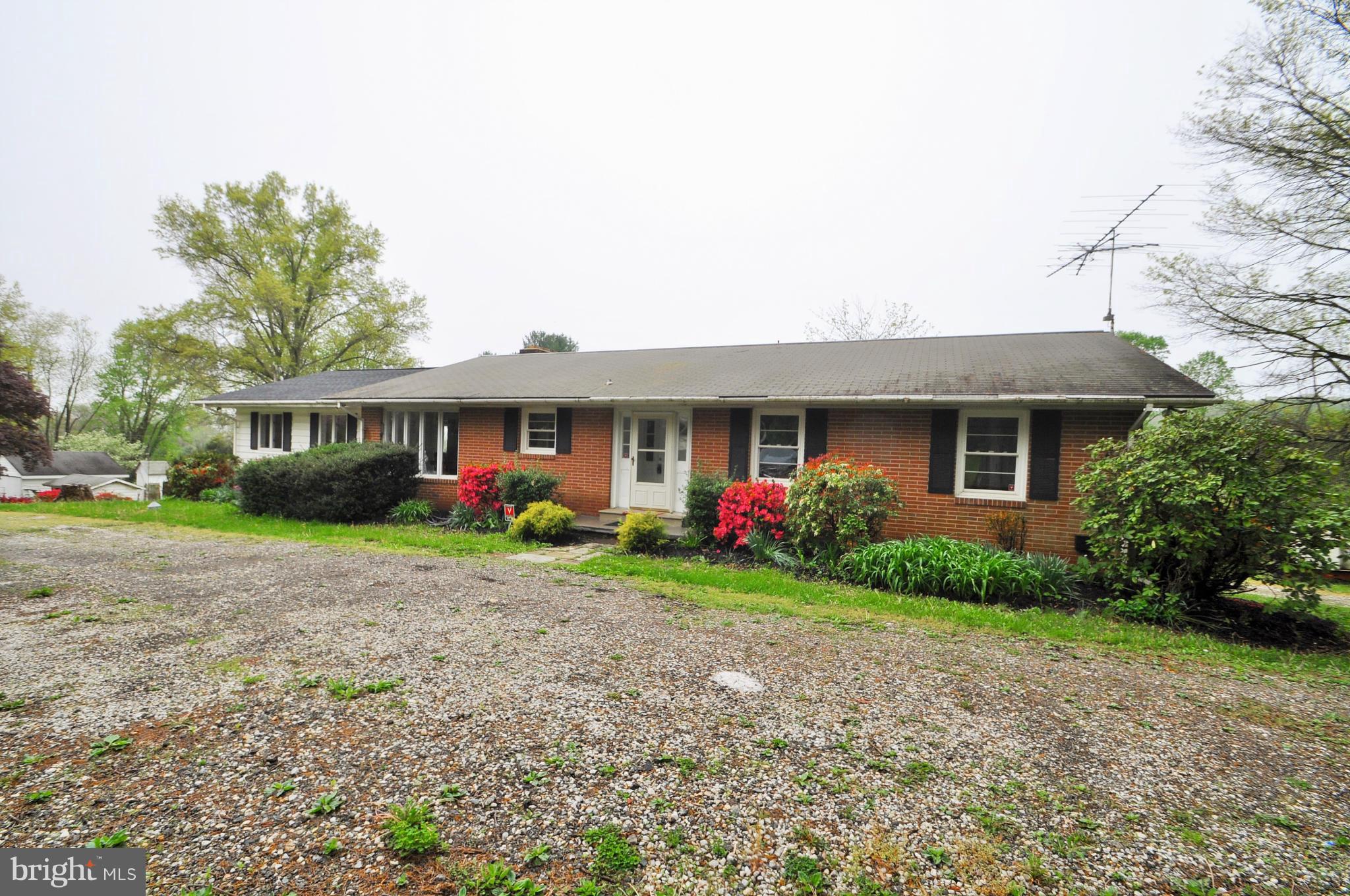 13718 Baldwin Mill Road Baldwin, MD 21013 - Photo 2 of 29 a front view of a house with garden