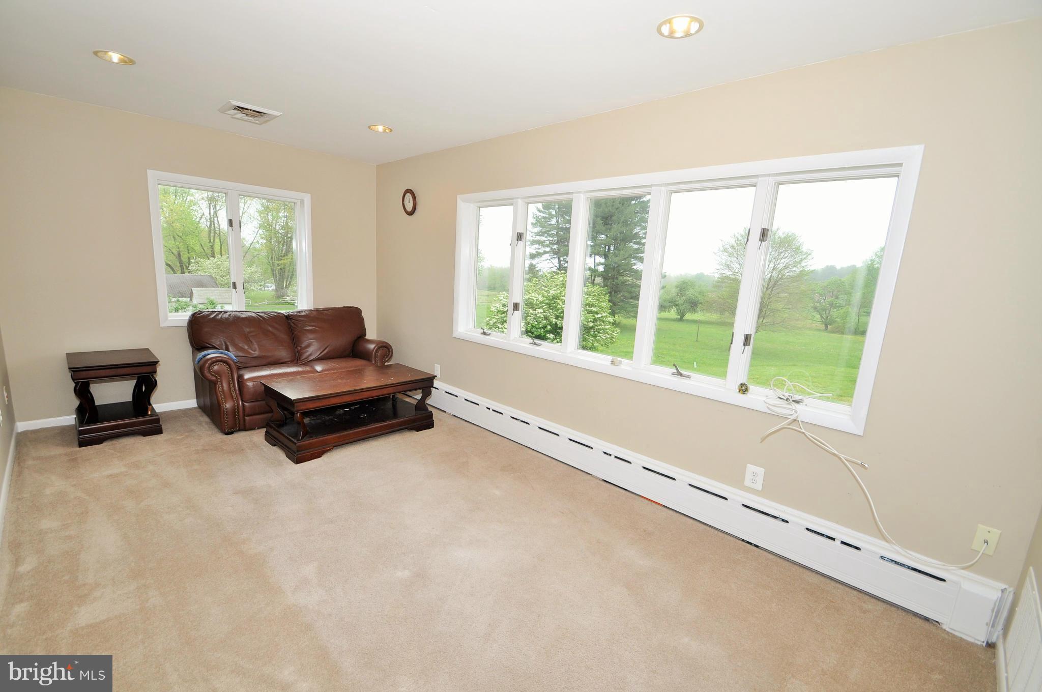 13718 Baldwin Mill Road Baldwin, MD 21013 - Photo 12 of 29 a living room with furniture and a large window