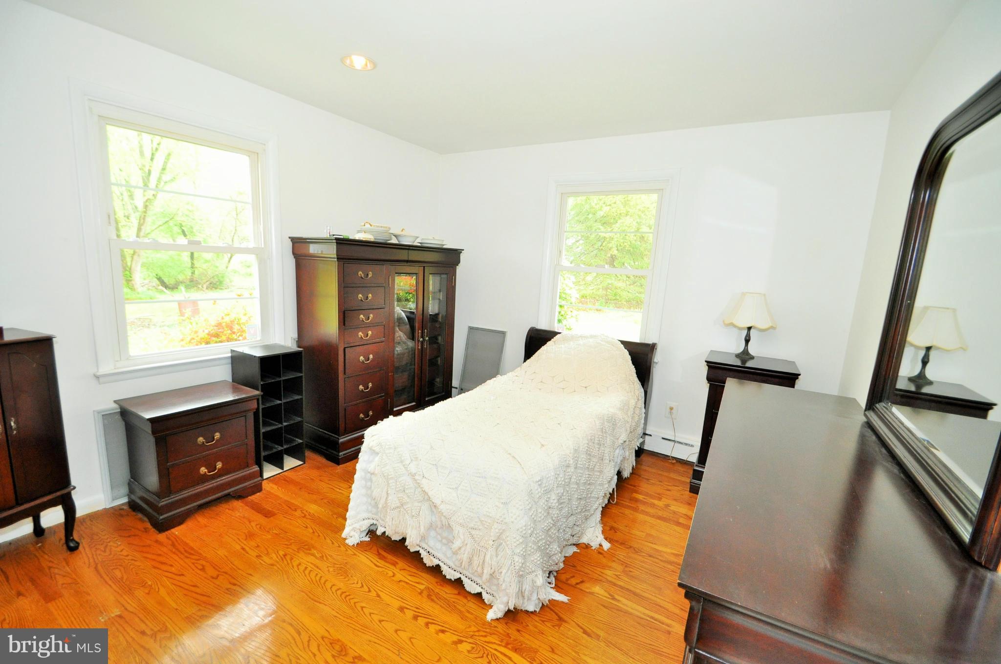 13718 Baldwin Mill Road Baldwin, MD 21013 - Photo 18 of 29 a bed room with a bed window and a dresser