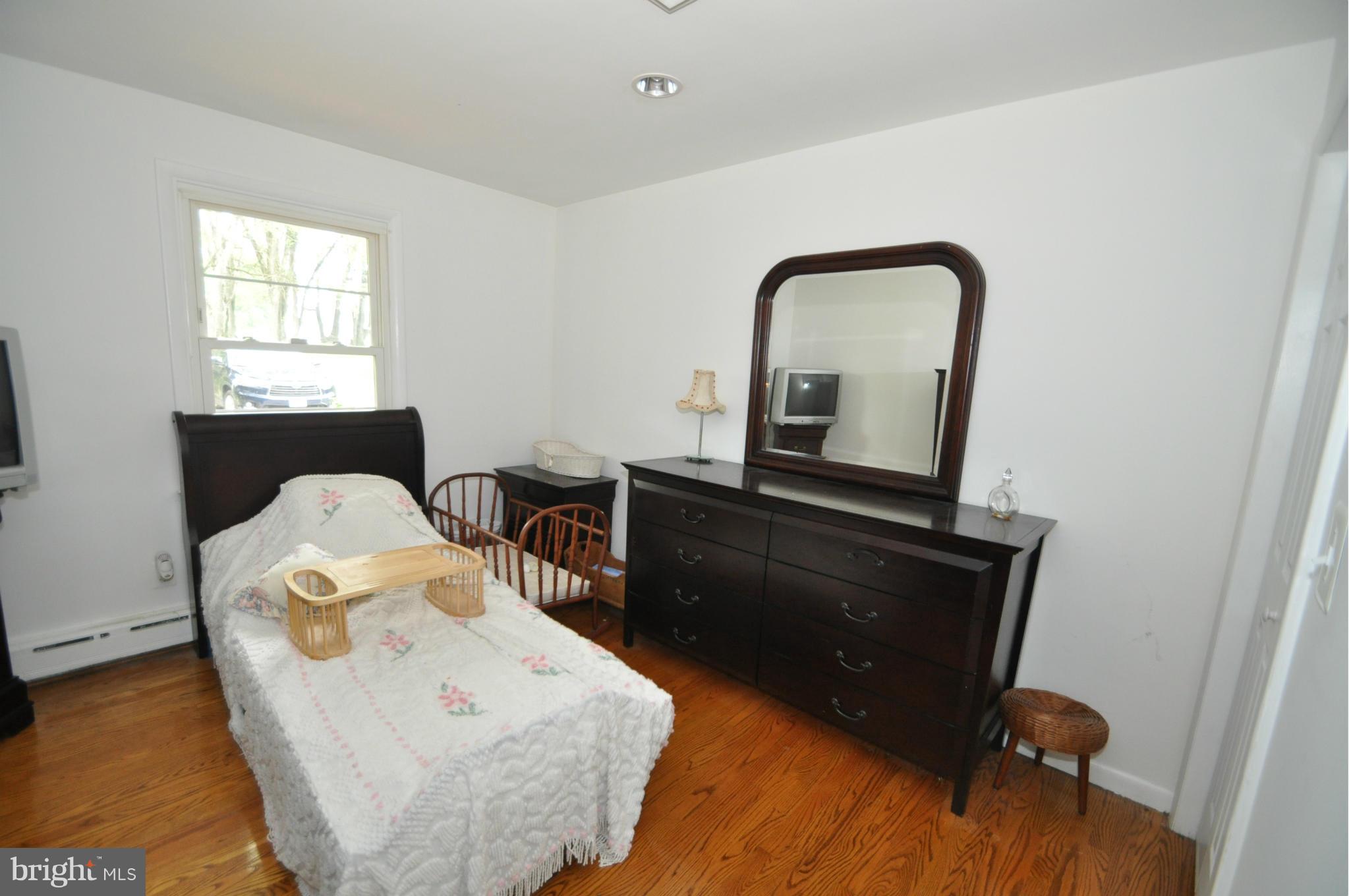13718 Baldwin Mill Road Baldwin, MD 21013 - Photo 19 of 29 a living room with furniture and a window