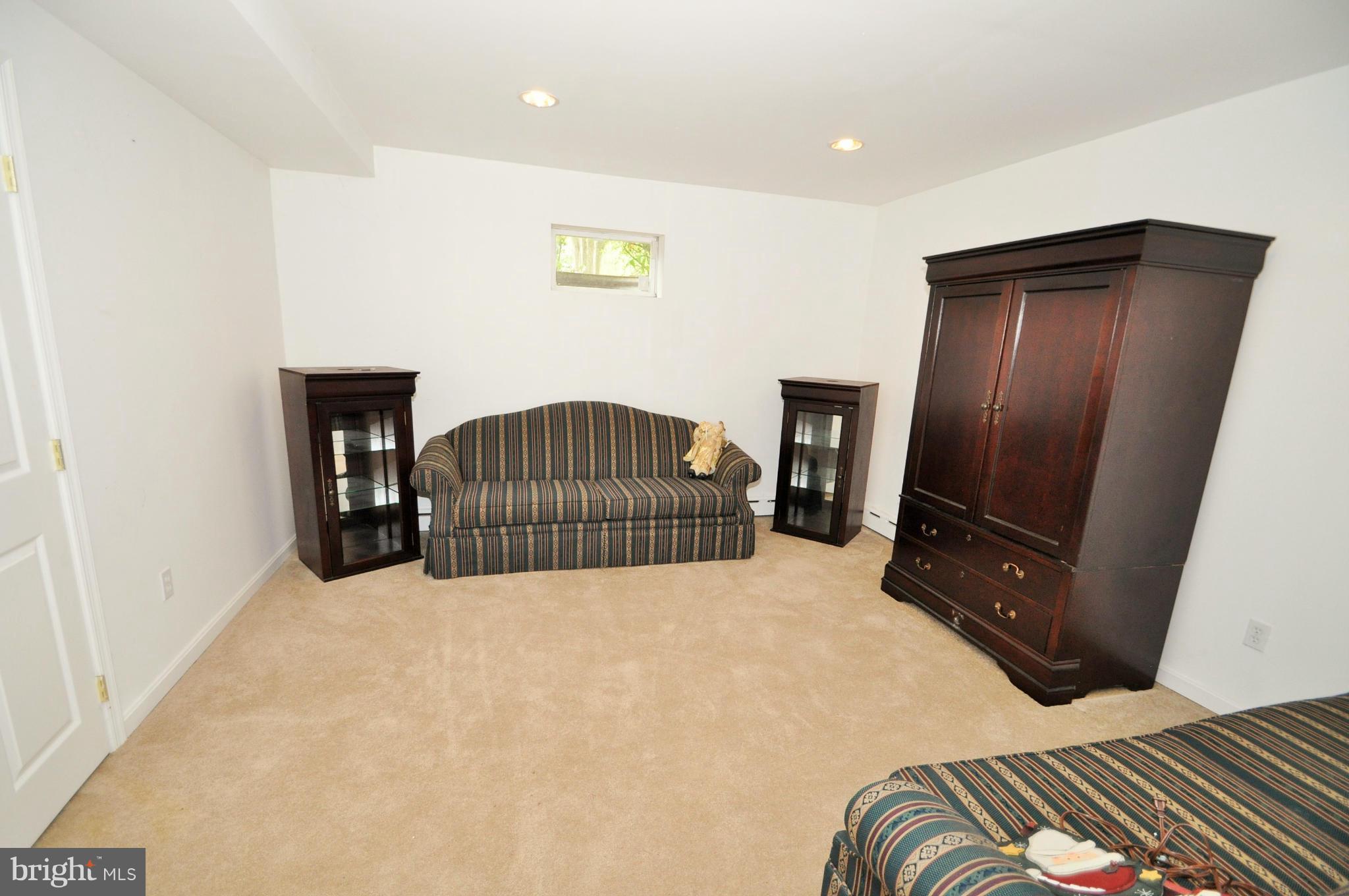 13718 Baldwin Mill Road Baldwin, MD 21013 - Photo 23 of 29 a bedroom with a bed and dresser