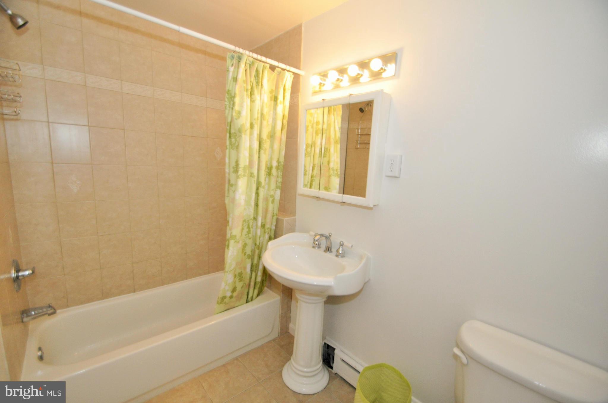 13718 Baldwin Mill Road Baldwin, MD 21013 - Photo 25 of 29 a bathroom with a sink toilet and shower