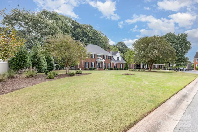 a swimming pool view with a outdoor seating