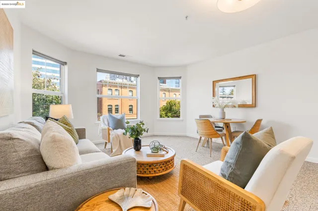 a living room with furniture fireplace and window