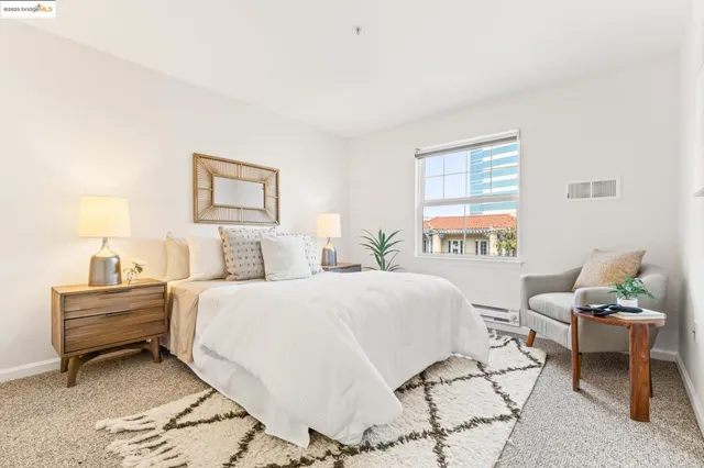 a bedroom with a bed and a couch