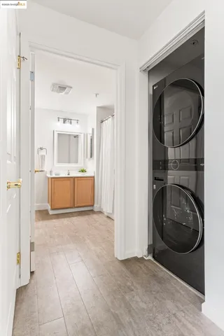 a view of a hallway with washer and dryer