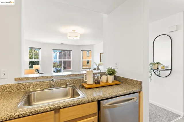 a kitchen with a sink and a window